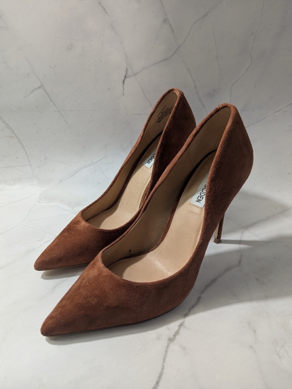 Brown suede pumps